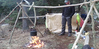 Cooking Tripod & Fire beside a Shelter Cooking Tripod & Fire beside a Shelter